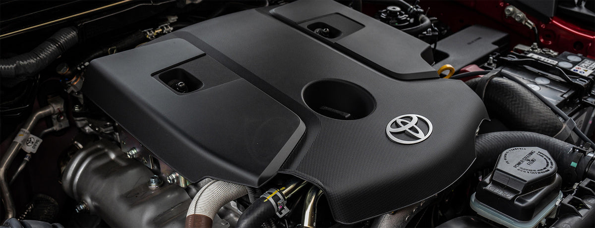 Toyota engine, located within the red engine bay